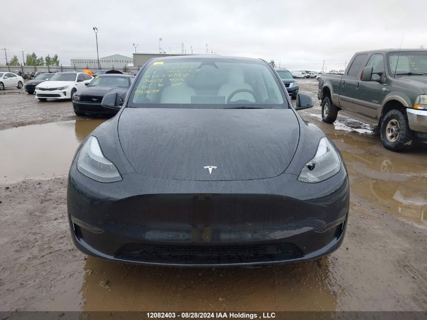 2024 Tesla Model Y VIN: 7SAYGDEF2RF107748 Lot: 12082403