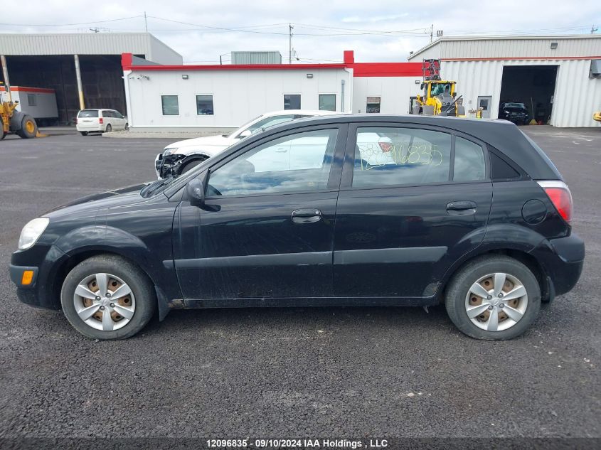 2009 Kia Rio VIN: KNADE243296453319 Lot: 12096835