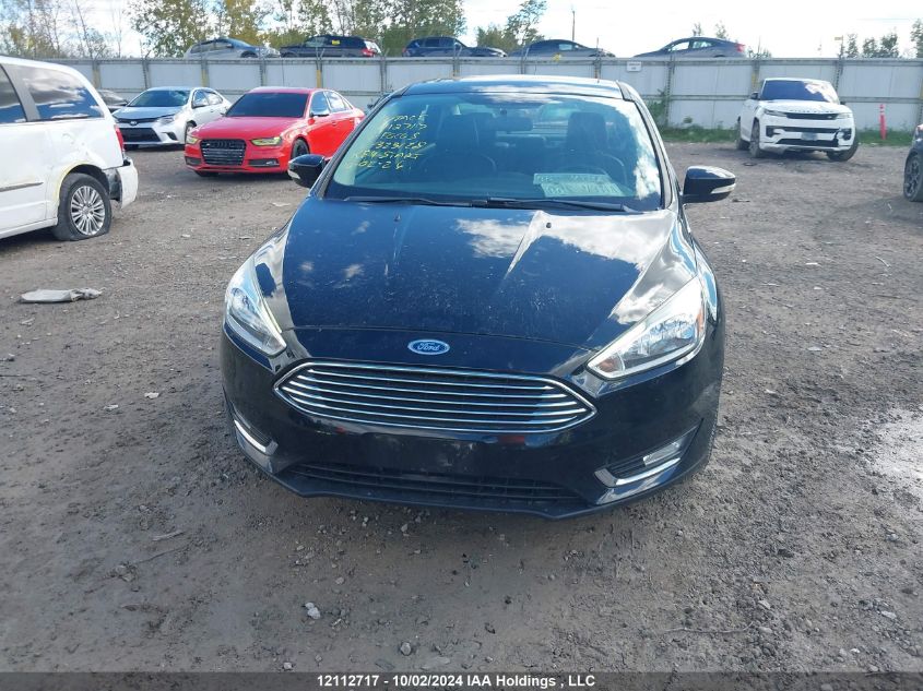 2016 Ford Focus VIN: 1FADP3J2XGL323128 Lot: 12112717