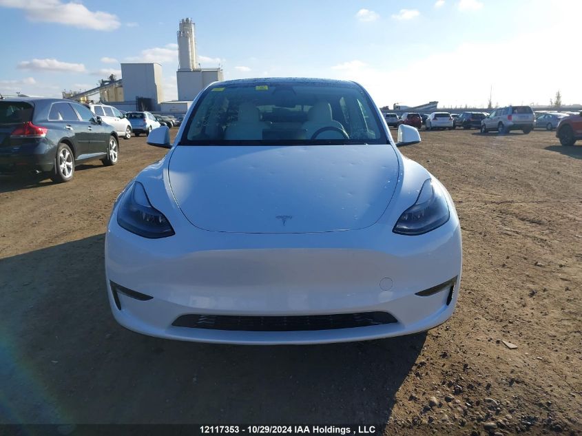 2023 Tesla Model Y VIN: 7SAYGDEE8PF765076 Lot: 12117353