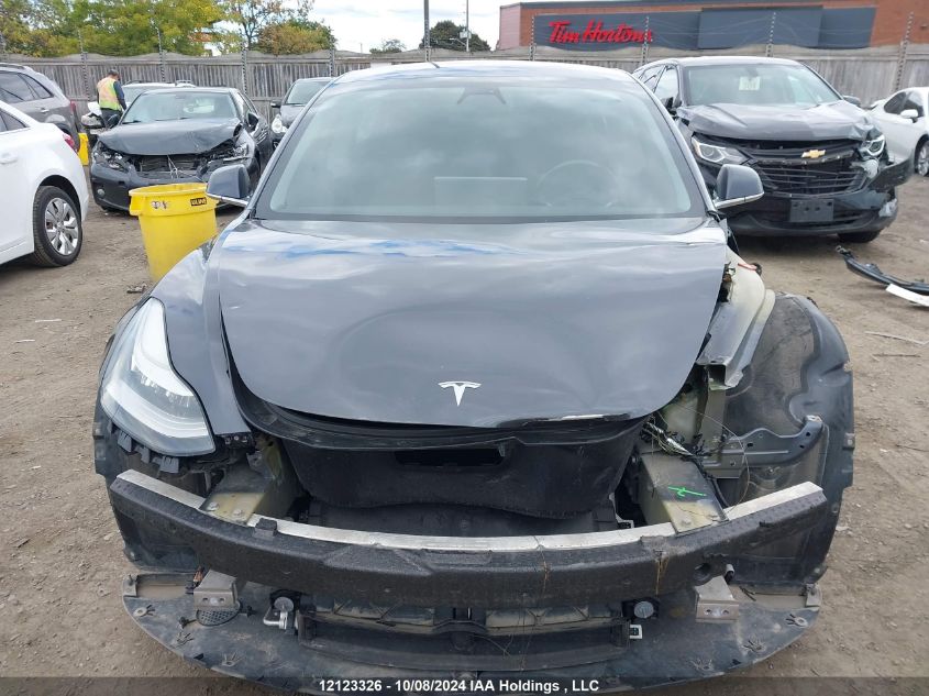 2019 Tesla Model 3 VIN: 5YJ3E1EB2KF205712 Lot: 12123326