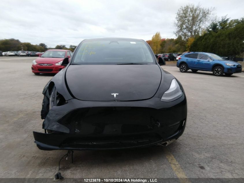 2024 Tesla Model Y VIN: 7SAYGDEE9RF110573 Lot: 12123878