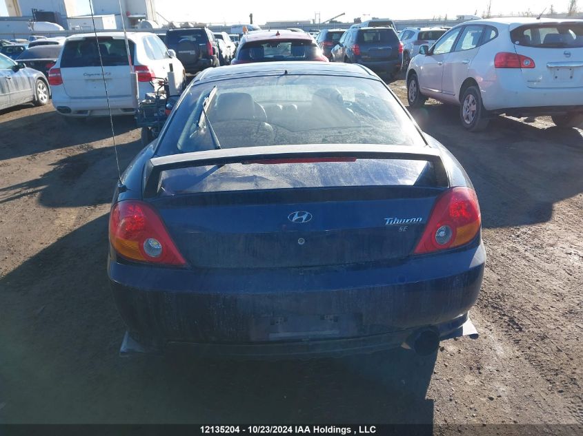 2003 Hyundai Tiburon VIN: KMHHN65D33U019797 Lot: 12135204