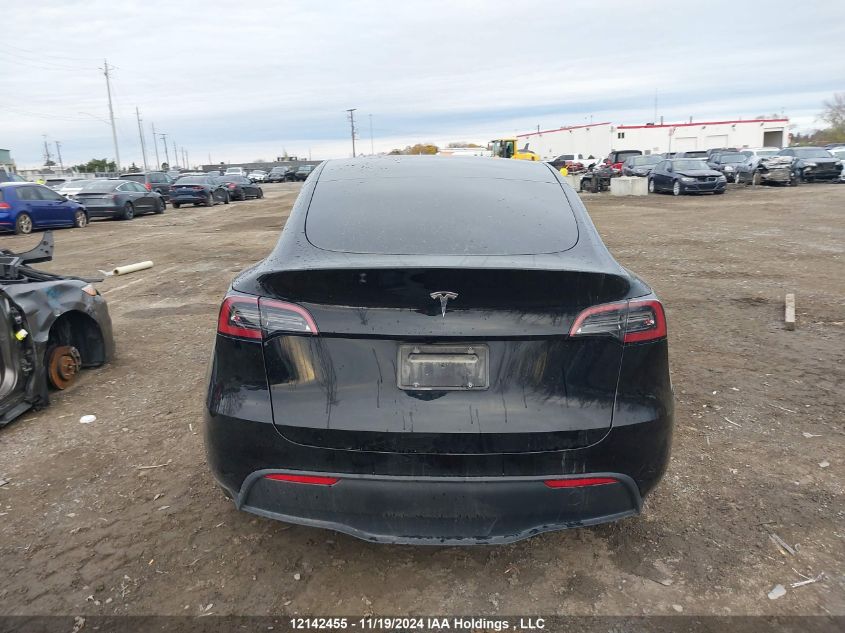 2024 Tesla Model Y VIN: 7SAYGDED5RF991229 Lot: 12142455