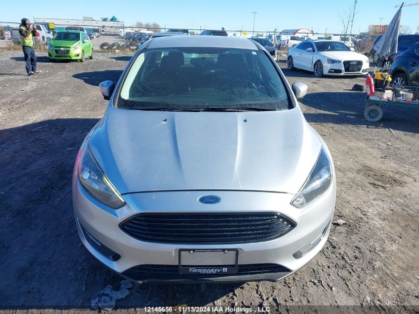 2018 Ford Focus VIN: 1FADP3FE7JL290373 Lot: 12145658