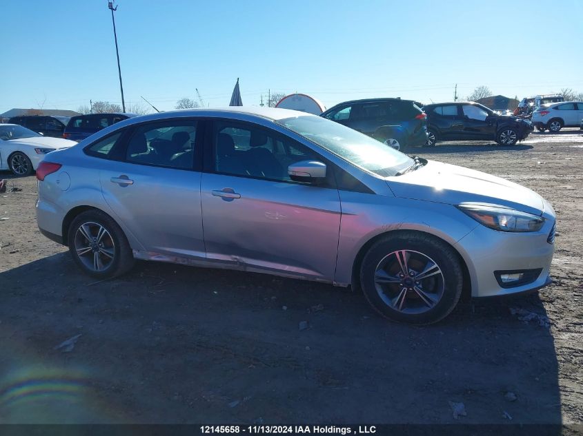 2018 Ford Focus VIN: 1FADP3FE7JL290373 Lot: 12145658