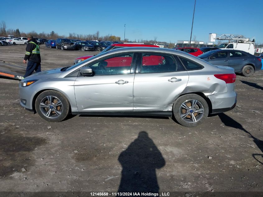 2018 Ford Focus VIN: 1FADP3FE7JL290373 Lot: 12145658