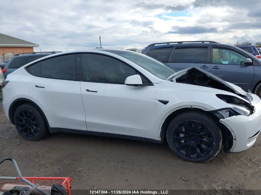 2023 Tesla Model Y VIN: 7SAYGDEE6PF583196 Lot: 12147304