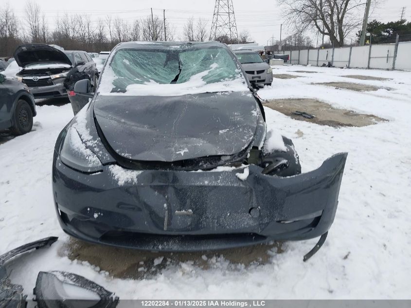 2024 Tesla Model Y Long Range VIN: 7SAYGDEE8RF991153 Lot: 12202284