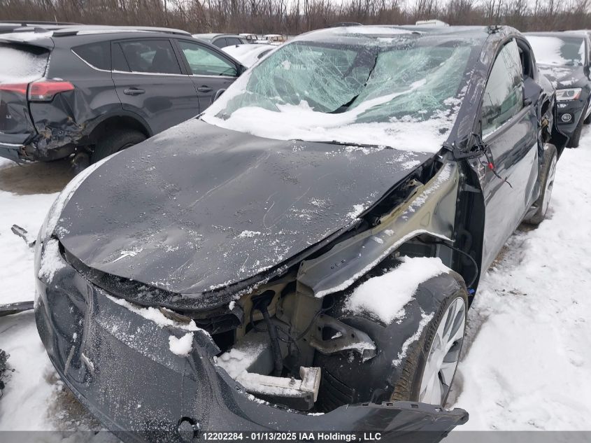 2024 Tesla Model Y Long Range VIN: 7SAYGDEE8RF991153 Lot: 12202284