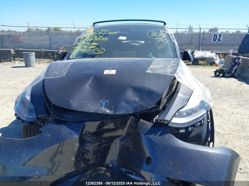 2024 Tesla Model Y Long Range VIN: 7SAYGDEE9RF989878 Lot: 12382389