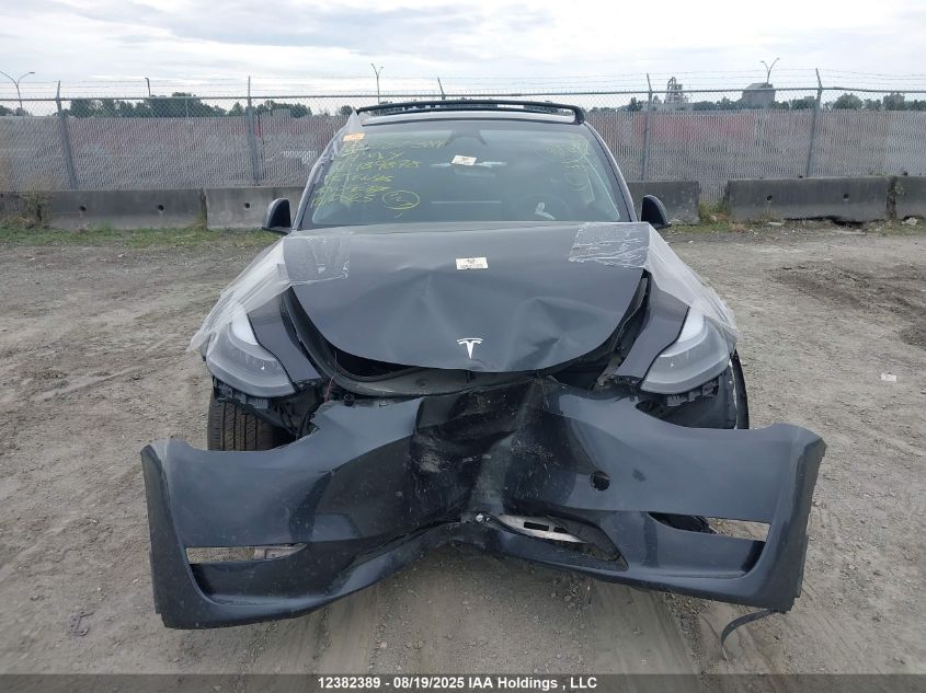 2024 Tesla Model Y Long Range VIN: 7SAYGDEE9RF989878 Lot: 12382389