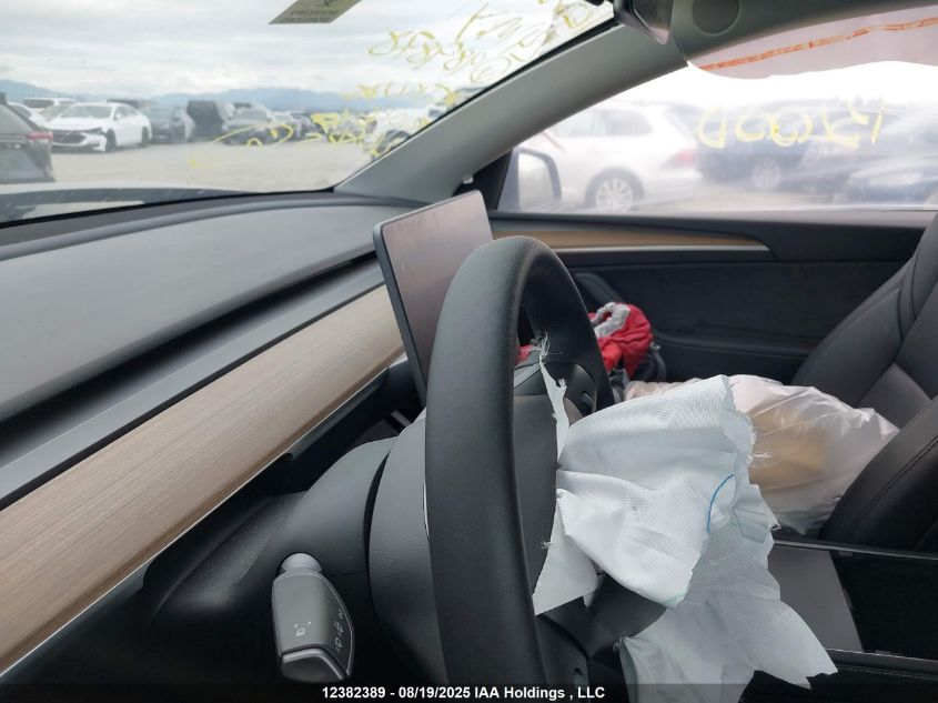 2024 Tesla Model Y Long Range VIN: 7SAYGDEE9RF989878 Lot: 12382389