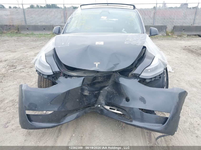 2024 Tesla Model Y Long Range VIN: 7SAYGDEE9RF989878 Lot: 12382389