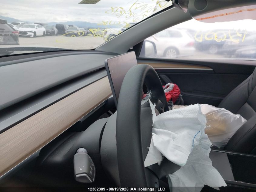 2024 Tesla Model Y Long Range VIN: 7SAYGDEE9RF989878 Lot: 12382389