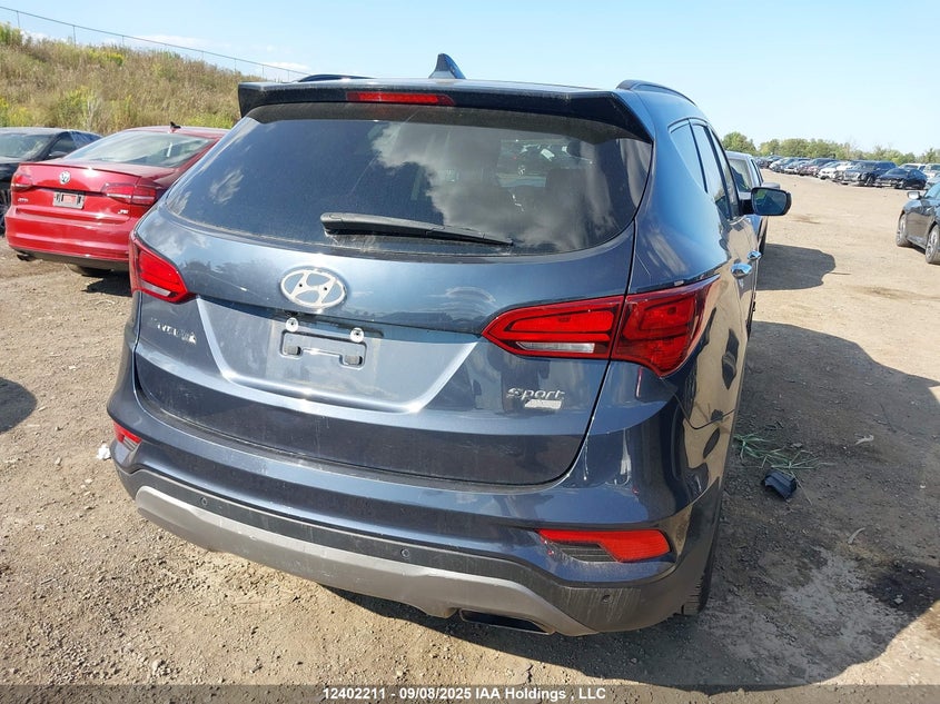 5NMZUDLB4JH055312 2018 HYUNDAI SANTA FE photo no. 4