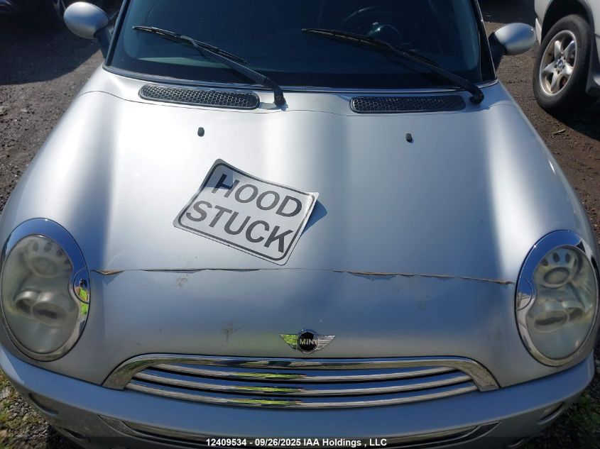 2006 Mini Cooper VIN: WMWRC33586TK18036 Lot: 12409534