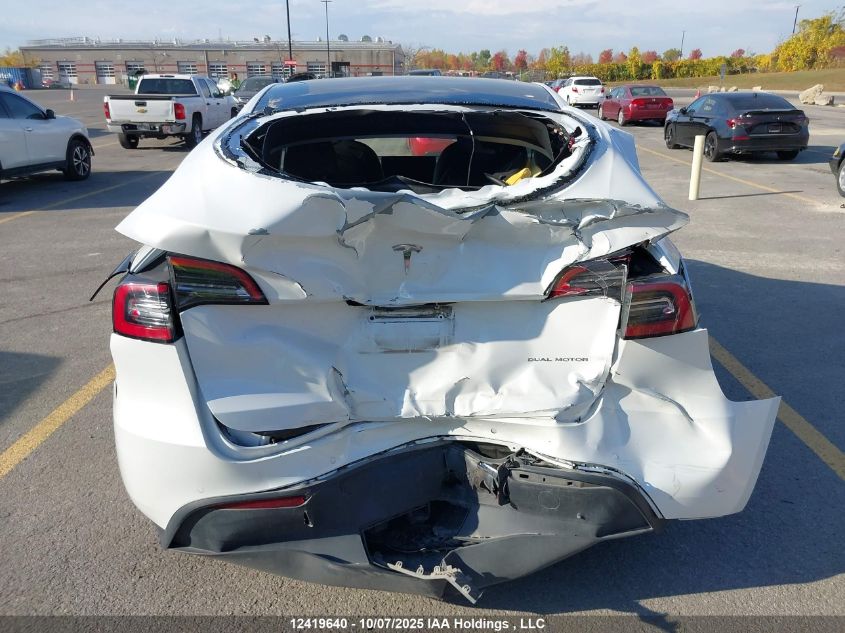 2022 Tesla Model Y Long Range VIN: 7SAYGAEEXNF570656 Lot: 12419640