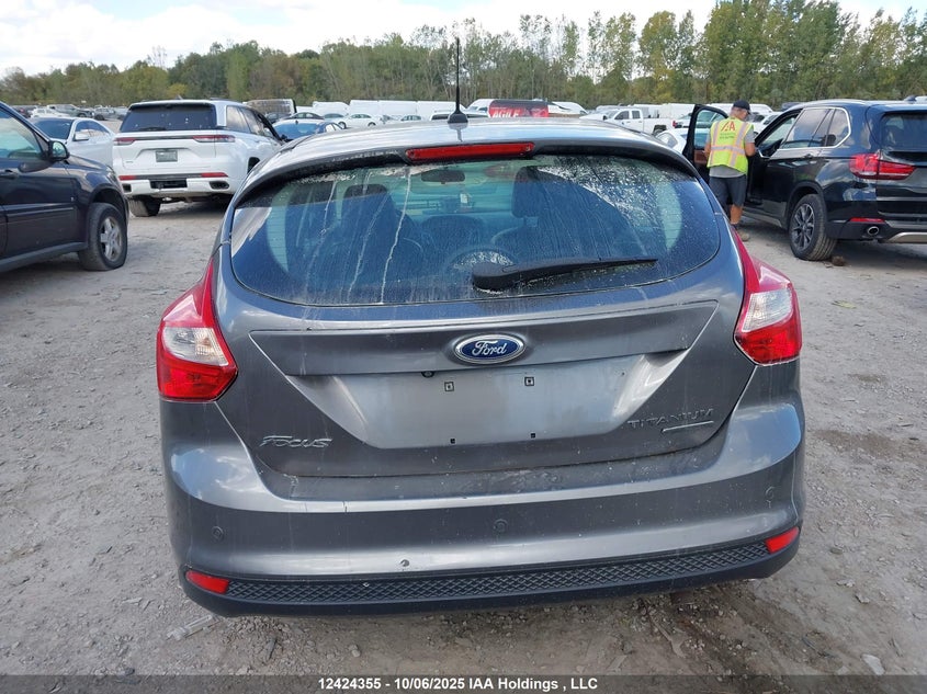 2014 Ford Focus Titanium VIN: 1FADP3N21EL314924 Lot: 12424355