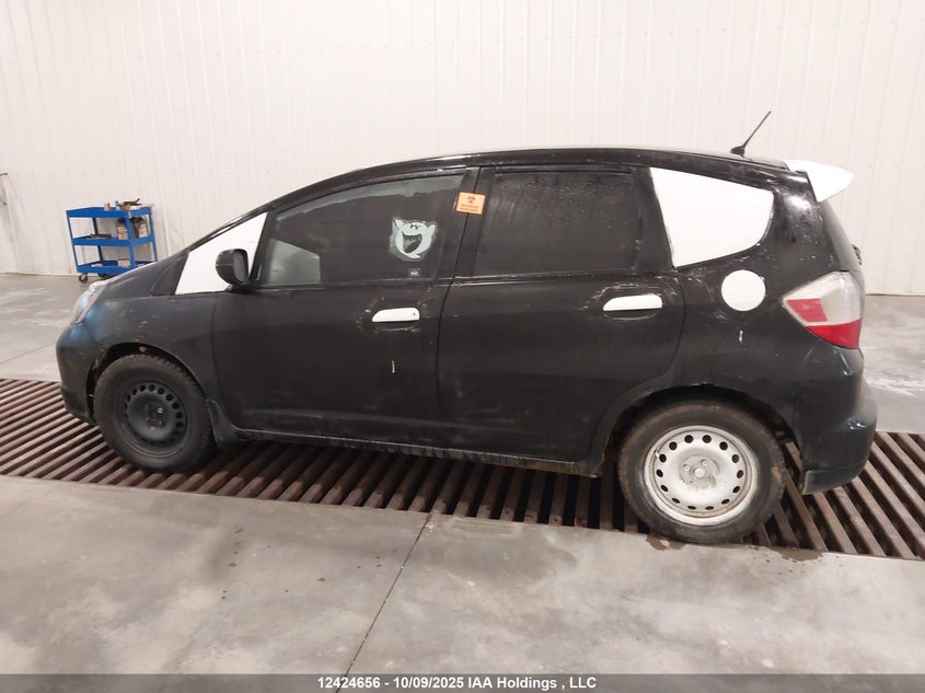 2009 Honda Fit Lx VIN: JHMGE87519S802119 Lot: 12424656