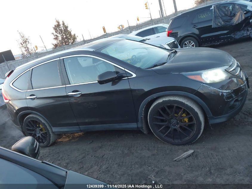 2014 Honda Cr-V Touring VIN: 2HKRM4H93EH121184 Lot: 12439399