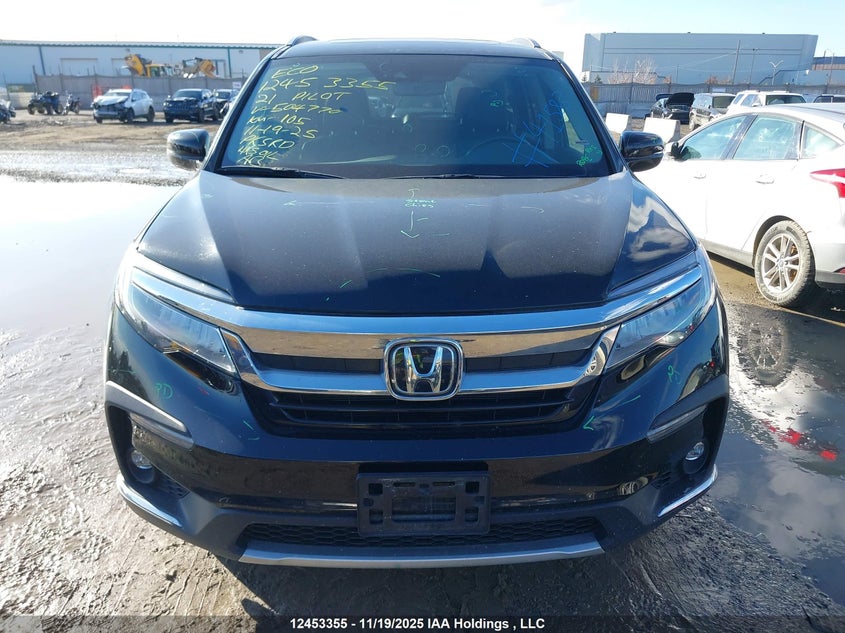 2021 Honda Pilot Touring 8P VIN: 5FNYF6H95MB504770 Lot: 12453355