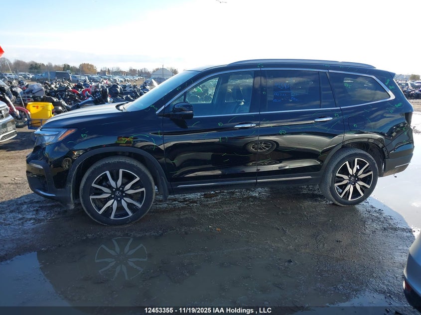 2021 Honda Pilot Touring 8P VIN: 5FNYF6H95MB504770 Lot: 12453355