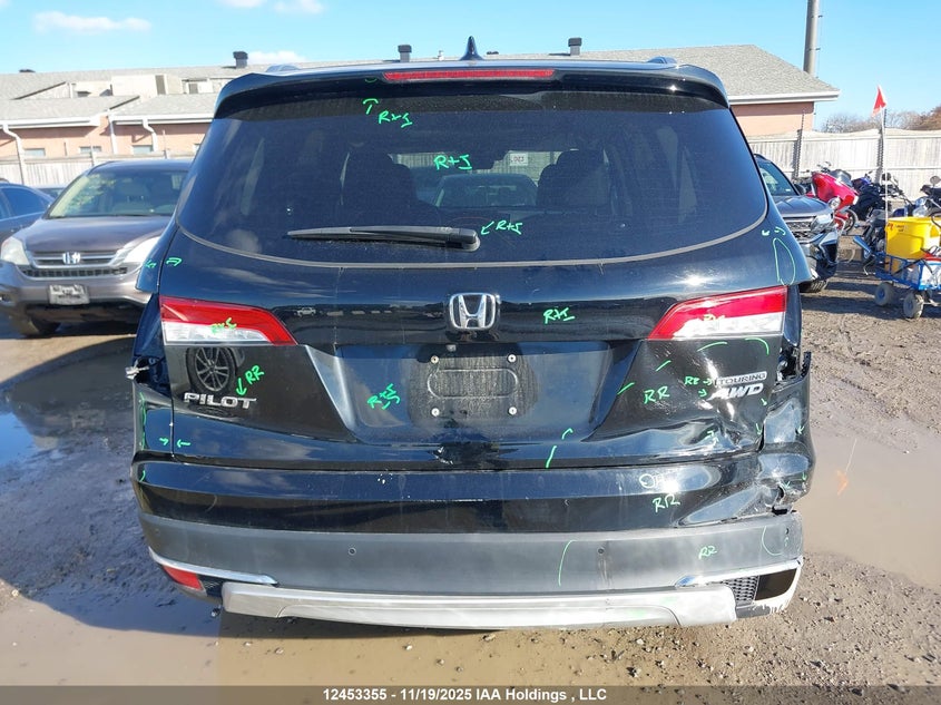 2021 Honda Pilot Touring 8P VIN: 5FNYF6H95MB504770 Lot: 12453355