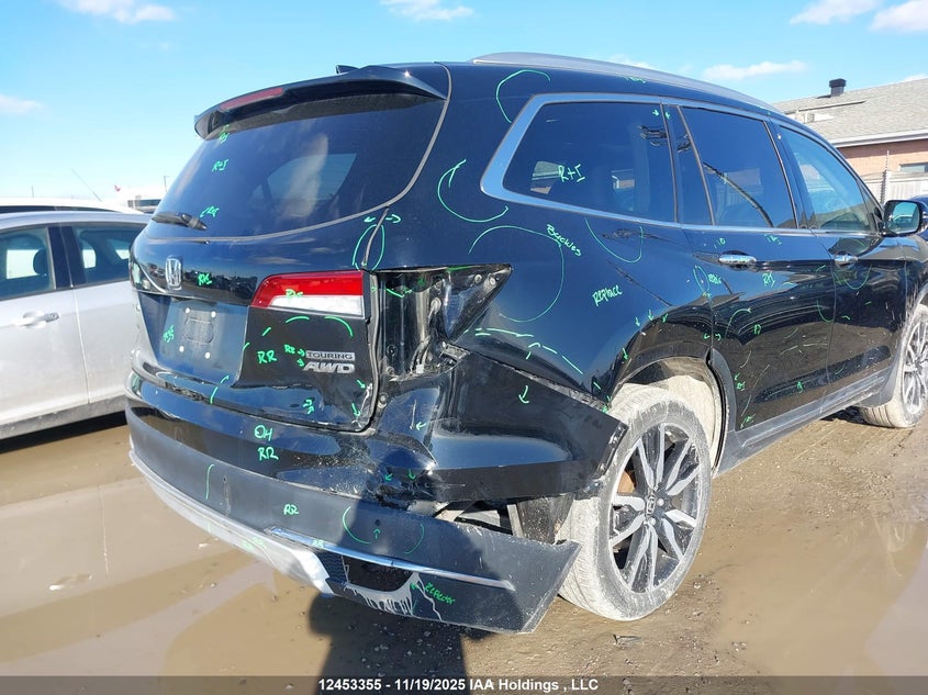 2021 Honda Pilot Touring 8P VIN: 5FNYF6H95MB504770 Lot: 12453355