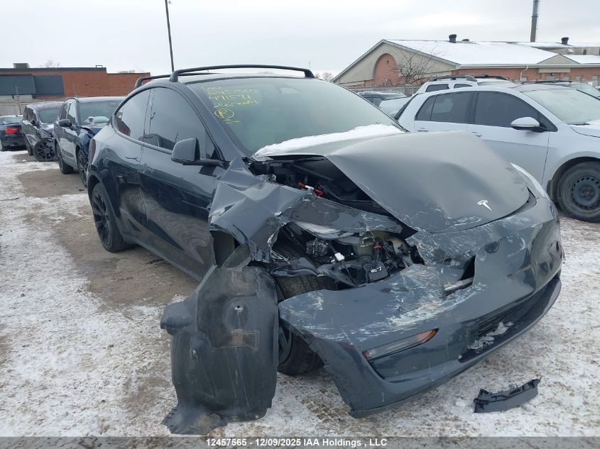 2024 Tesla Model Y Long Range VIN: 7SAYGDEEXRF991591 Lot: 12457565