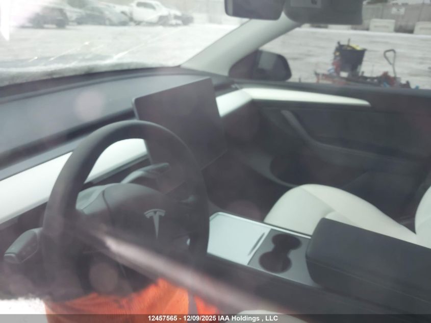 2024 Tesla Model Y Long Range VIN: 7SAYGDEEXRF991591 Lot: 12457565