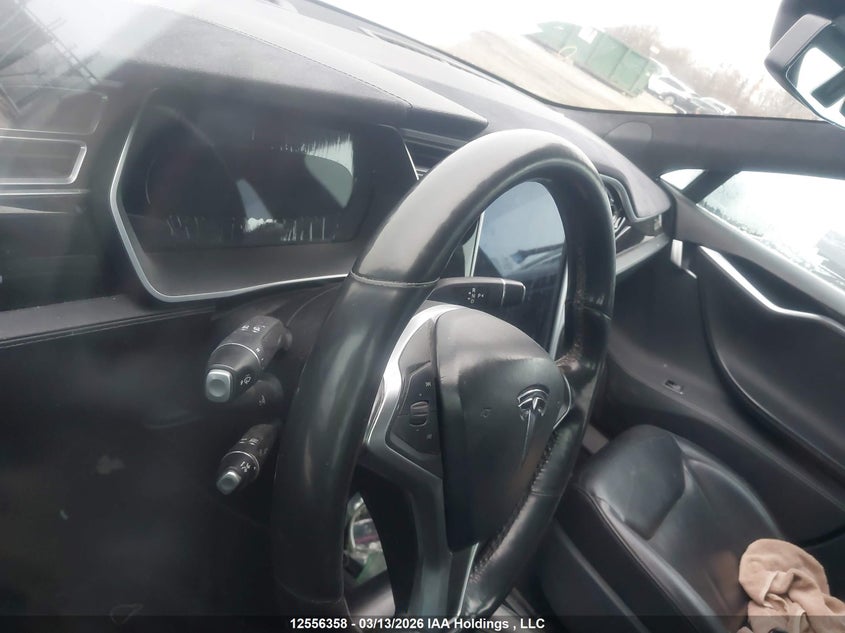 2015 Tesla Model S VIN: 5YJSA1E23FF106216 Lot: 12556358