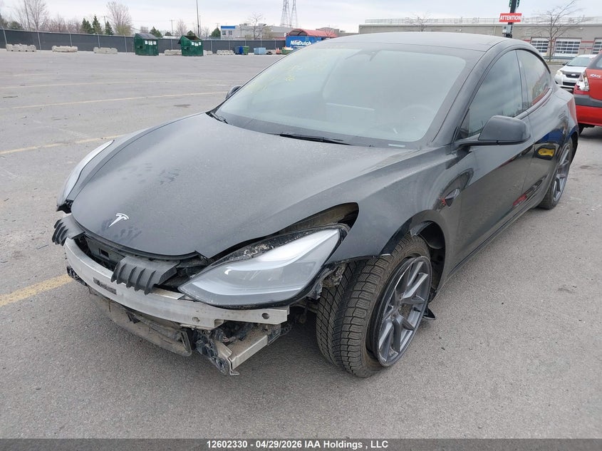 2023 Tesla Model 3 VIN LRW3E1FA4PC899732, IAAI stock 12602330 photo 2