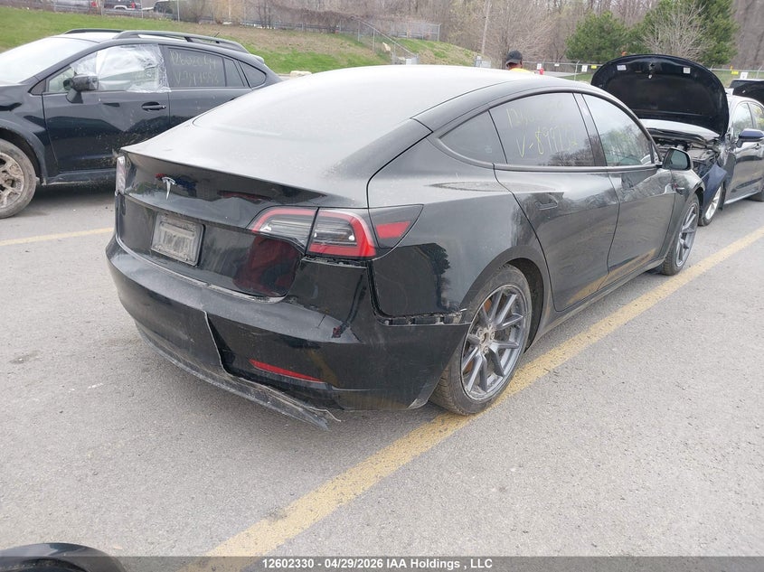 2023 Tesla Model 3 VIN LRW3E1FA4PC899732, IAAI stock 12602330 photo 4