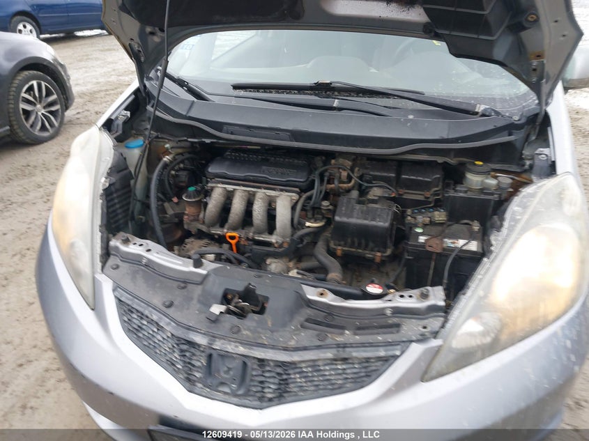 2009 Honda Fit Lx VIN: JHMGE87559S807081 Lot: 12609419