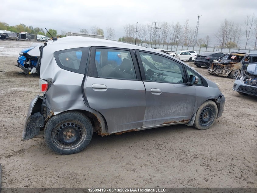 2009 Honda Fit Lx VIN: JHMGE87559S807081 Lot: 12609419