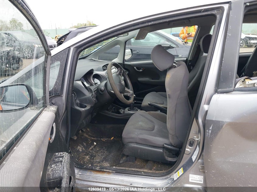 2009 Honda Fit Lx VIN: JHMGE87559S807081 Lot: 12609419