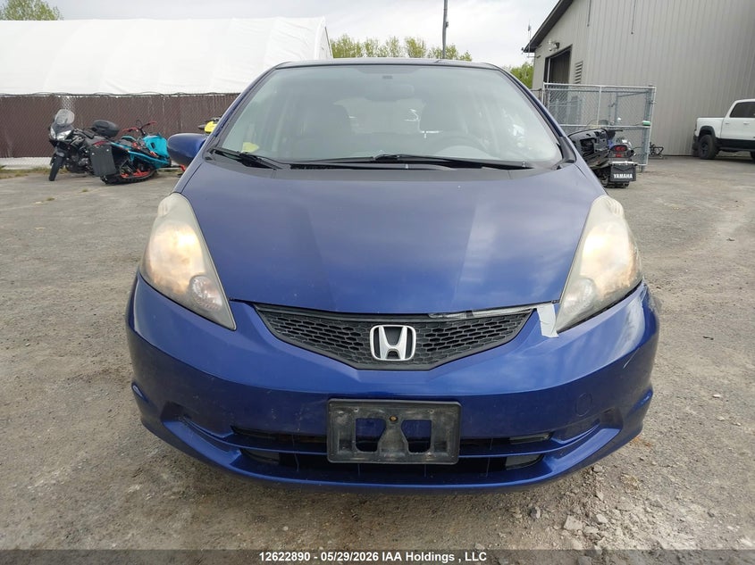 2011 Honda Fit Lx VIN: JHMGE8H55BC801795 Lot: 12622890