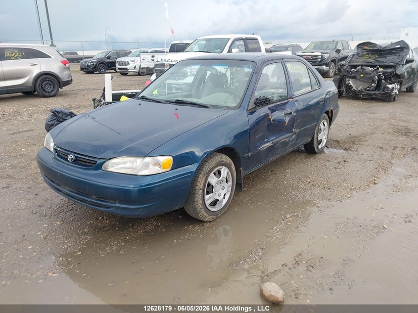 2000 Toyota Corolla, Левый бок, IAAI, VIN 2T1BR12E0YC796392 — фото 2
