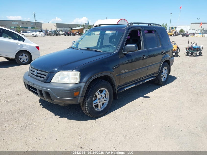 2001 Honda CR-V, Vandalized, IAAI, VIN JHLRD17401C809267 — photo 2