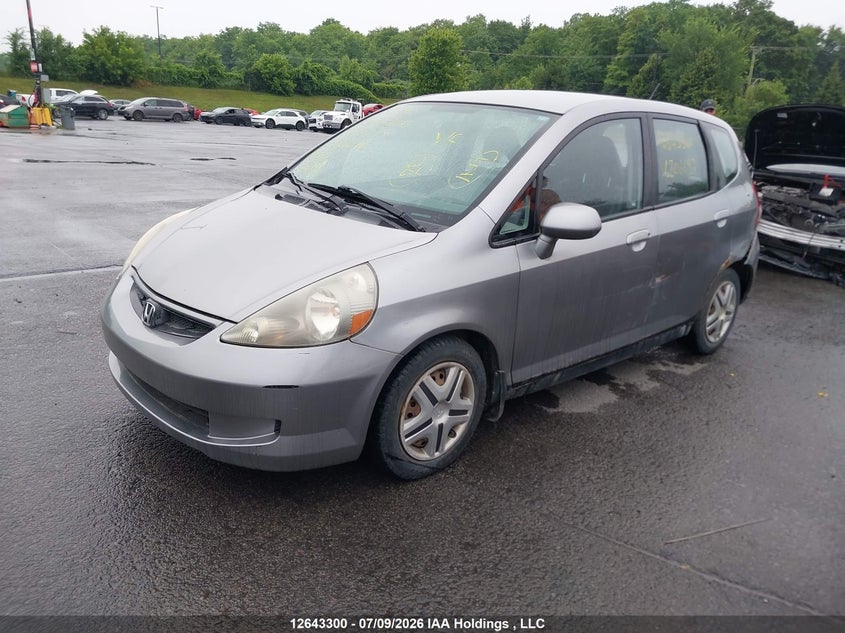 2007 Honda Fit, Левый бок, IAAI, VIN JHMGD38457S806697 — фото 2