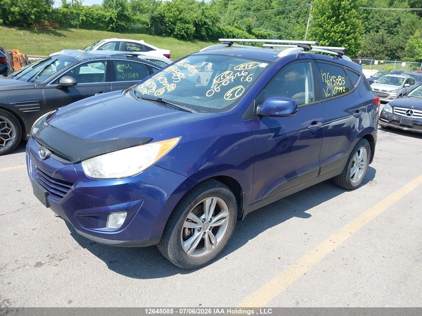 2011 Hyundai Tucson, Water, IAAI, VIN KM8JUCACXBU169792 — photo 2