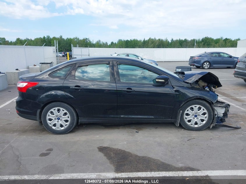2014 Ford Focus VIN: 1FADP3F2XEL335057 Lot: 12649372