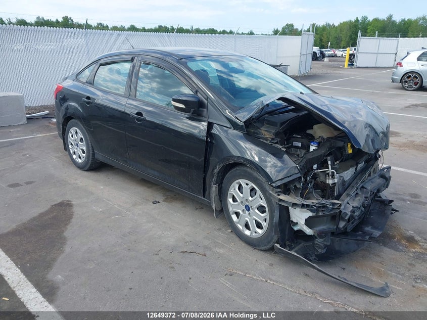 2014 Ford Focus VIN: 1FADP3F2XEL335057 Lot: 12649372