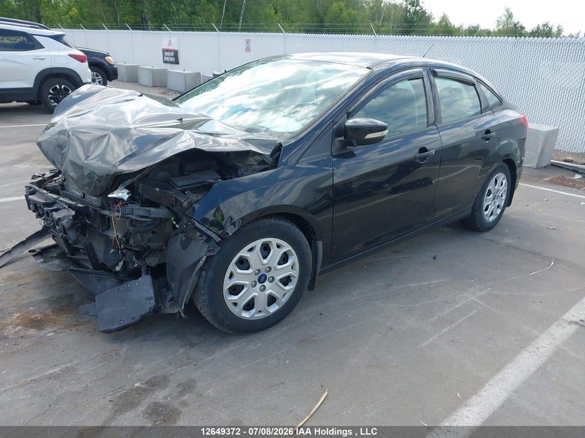 2014 Ford Focus VIN: 1FADP3F2XEL335057 Lot: 12649372