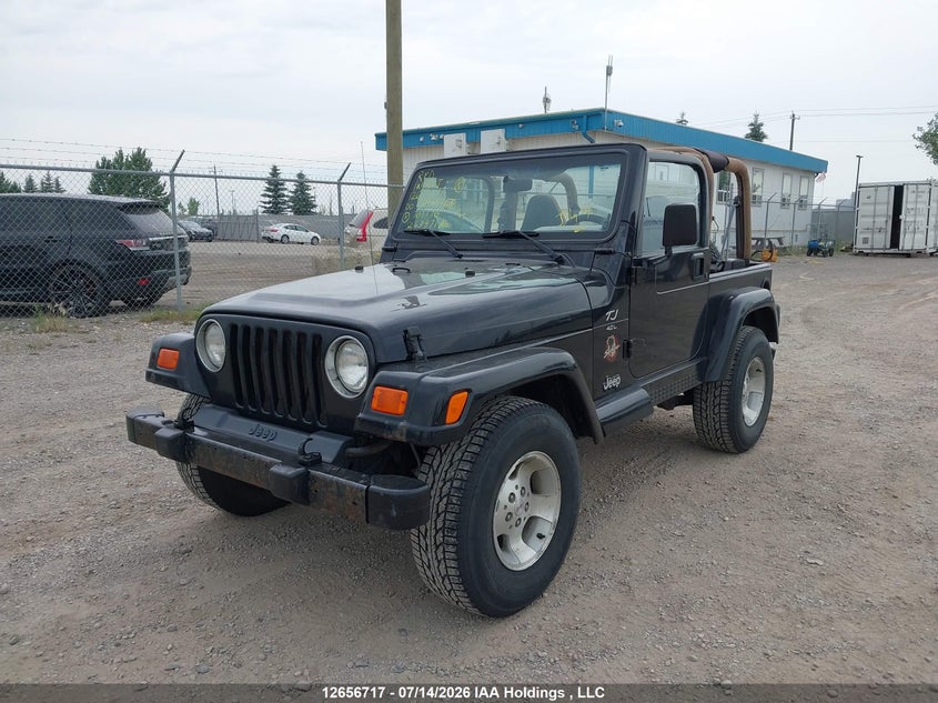 2000 Jeep Wrangler, Rear, IAAI, VIN 1J4FA59S4YP701176 — photo 2