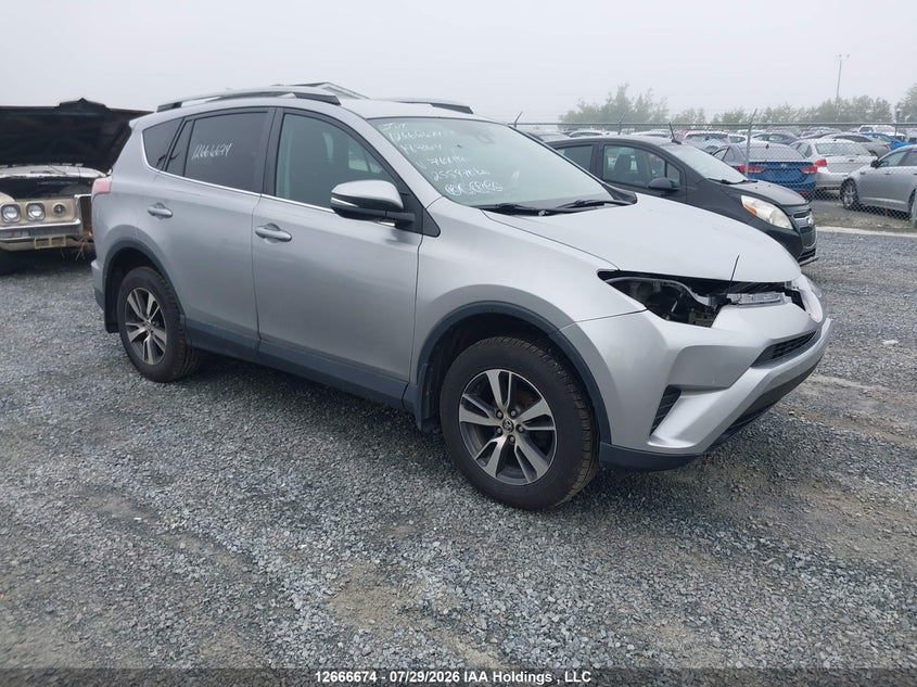 Vin: 2t3bfrev9jw768119, lot: 3069430, toyota rav4 le 2018 img_1