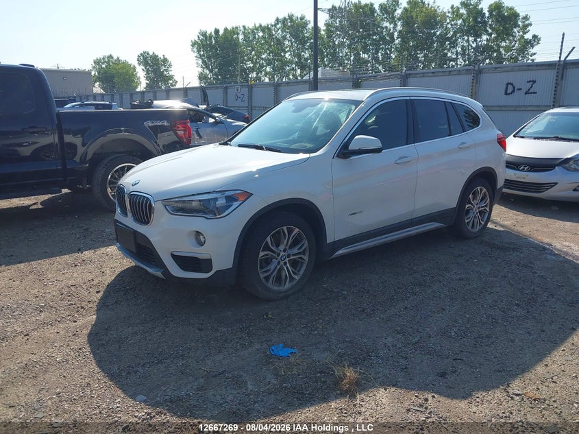 2018 BMW X1, Затопление, IAAI, VIN WBXHT3C3XJ5F91546 — фото 2