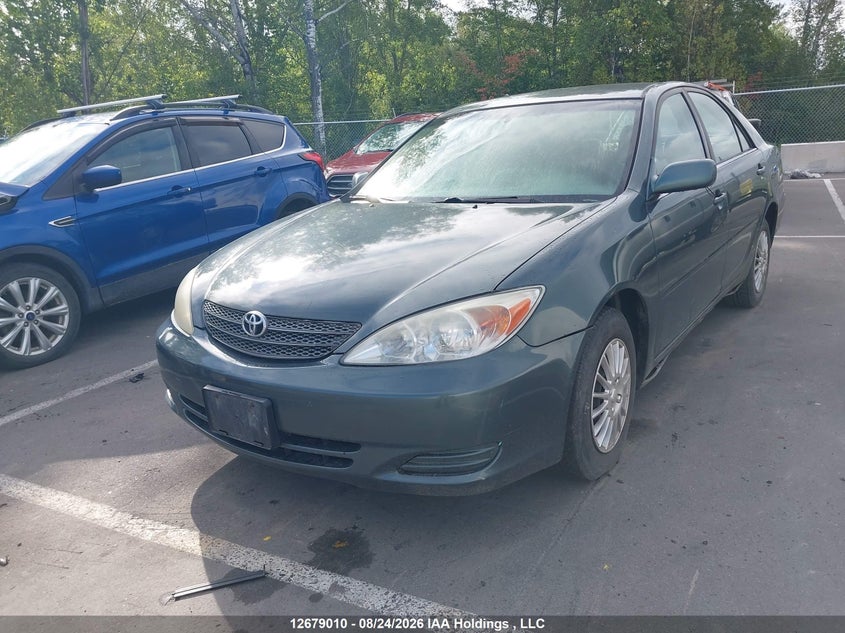 2003 Toyota Camry, Rear, IAAI, VIN JTDBE32K130209164 — photo 2