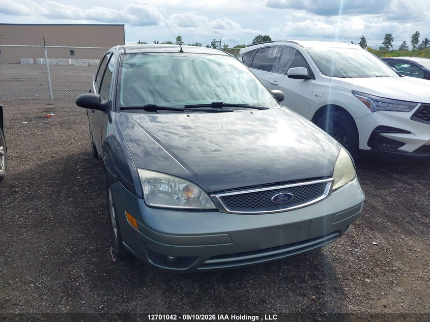 2005 Ford Focus Zx5, Удар спереди, IAAI, VIN 3FAFP37N65R153567